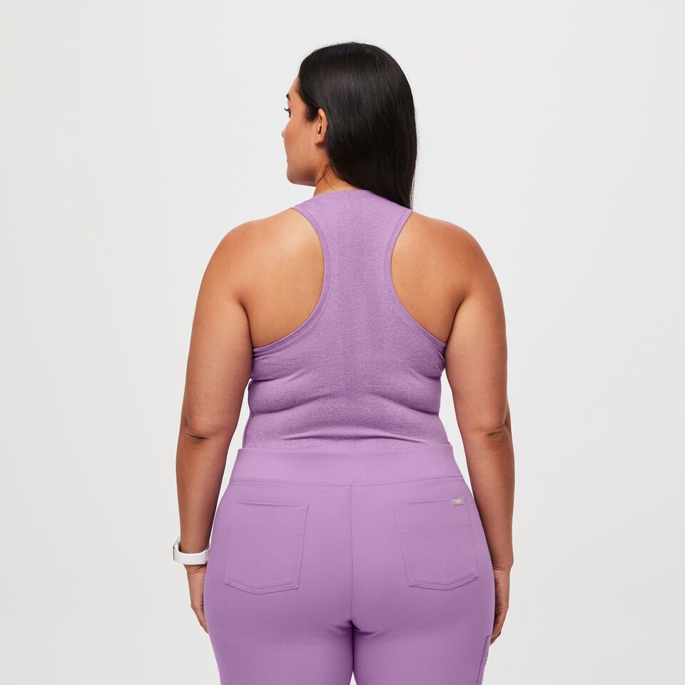 https://creative.wearfigs.com/asset/6ee3932d-8d22-4596-930a-832b322255d4/SQUARE/Womens-Salta-Seamless-Tank-Lilac-Dawn-XL-5