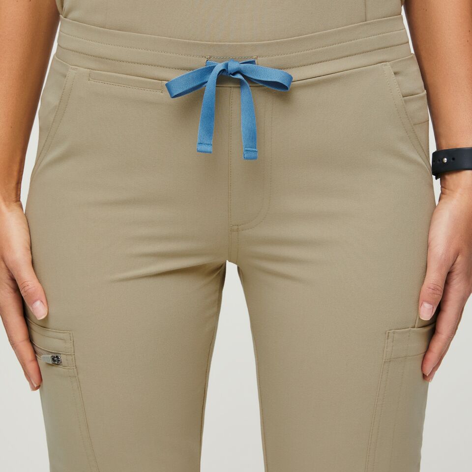 https://creative.wearfigs.com/m/14ec7e33a5d6be16/SQUARE-W_Yola_Pant_Sandstone_Q2_2022_-4